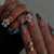 Künstlerisches 3D Blumen Nageldesign Brehn