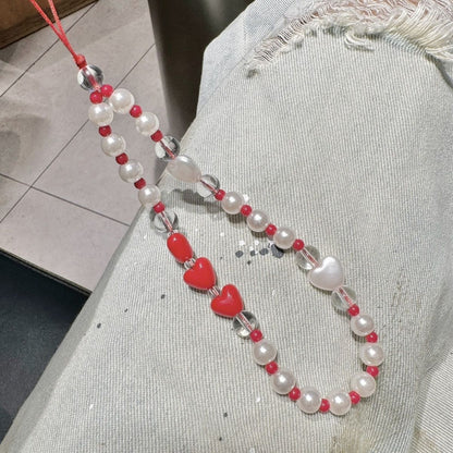 Perlen- und Herzperlen-Handyband Brehn