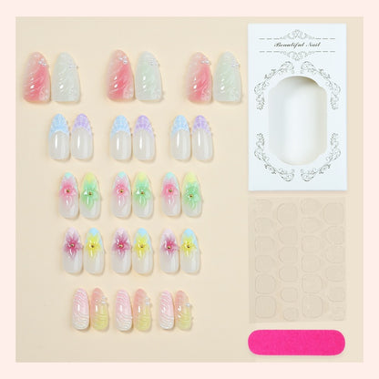 Kunstnagelset mit bunten floralem Design und Glitzerakzenten Brehn