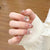 Dekoratives Strass-Bow Press-On Nagelset Brehn