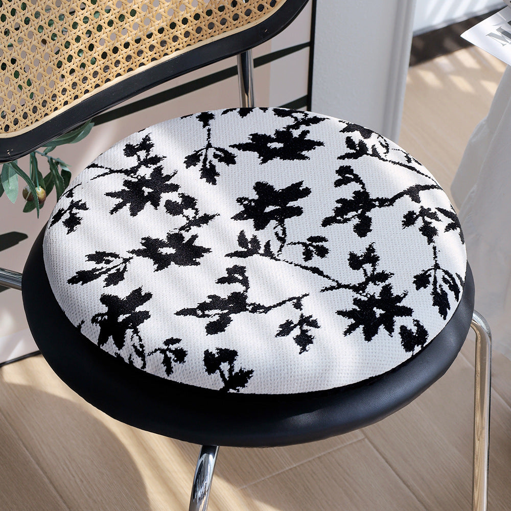 Rundes Sitzkissen mit gesteppter Polsterung, floralem Jacquard‑Bezug und Anti‑Rutsch‑Rückseite Brehn