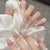 Elegante Ombre Press-On Fingernägel Set mit Perlenakzenten Brehn