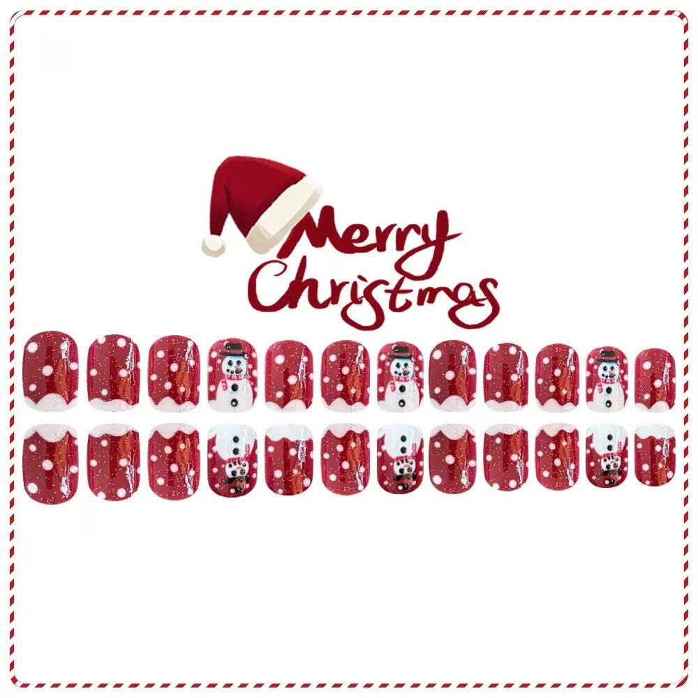 Kunstnagelset mit festlichen Schneemann-Motiven und Glitzerakzenten Brehn