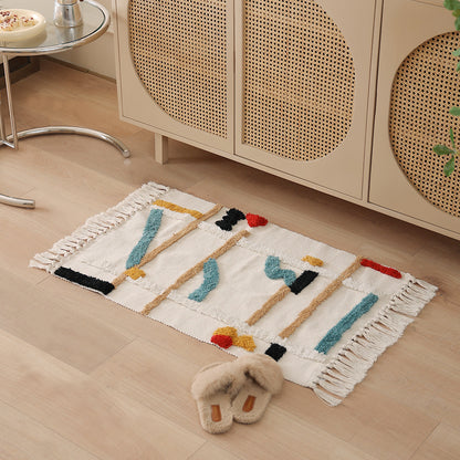 Gewebter Vorleger im Boho-Minimalstil mit kontrastiertem Tufting und Baumwollfransen Brehn