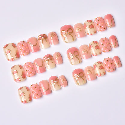 Elegantes Herz- und Band-Thema Press-On Nagelset Brehn