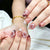 Kunstvolle Nagelspitzen mit Blumendekor Brehn