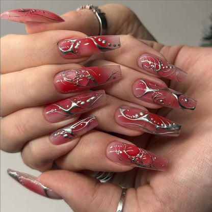 Kunstvolle Nagelverlängerungen mit floralem und glänzendem Design Brehn