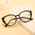 Damen Cat-Eye Korrektionsbrille mit glänzendem Kunststoffrahmen und goldenen Akzenten Brehn