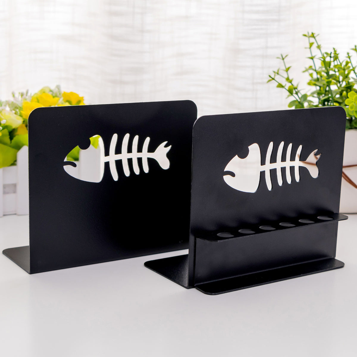 Künstlerische fischthematische Buchstützen