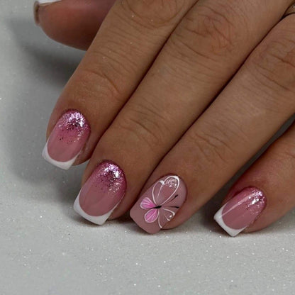 Kunstvolle Nagelkunst mit Glitzer und Schmetterlingsdesign Brehn