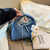 Stylische und funktionale Drawstring-Handtasche Brehn