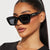 Damen quadratische Sonnenbrille mit transparentem Rahmen und braunen Gläsern Brehn