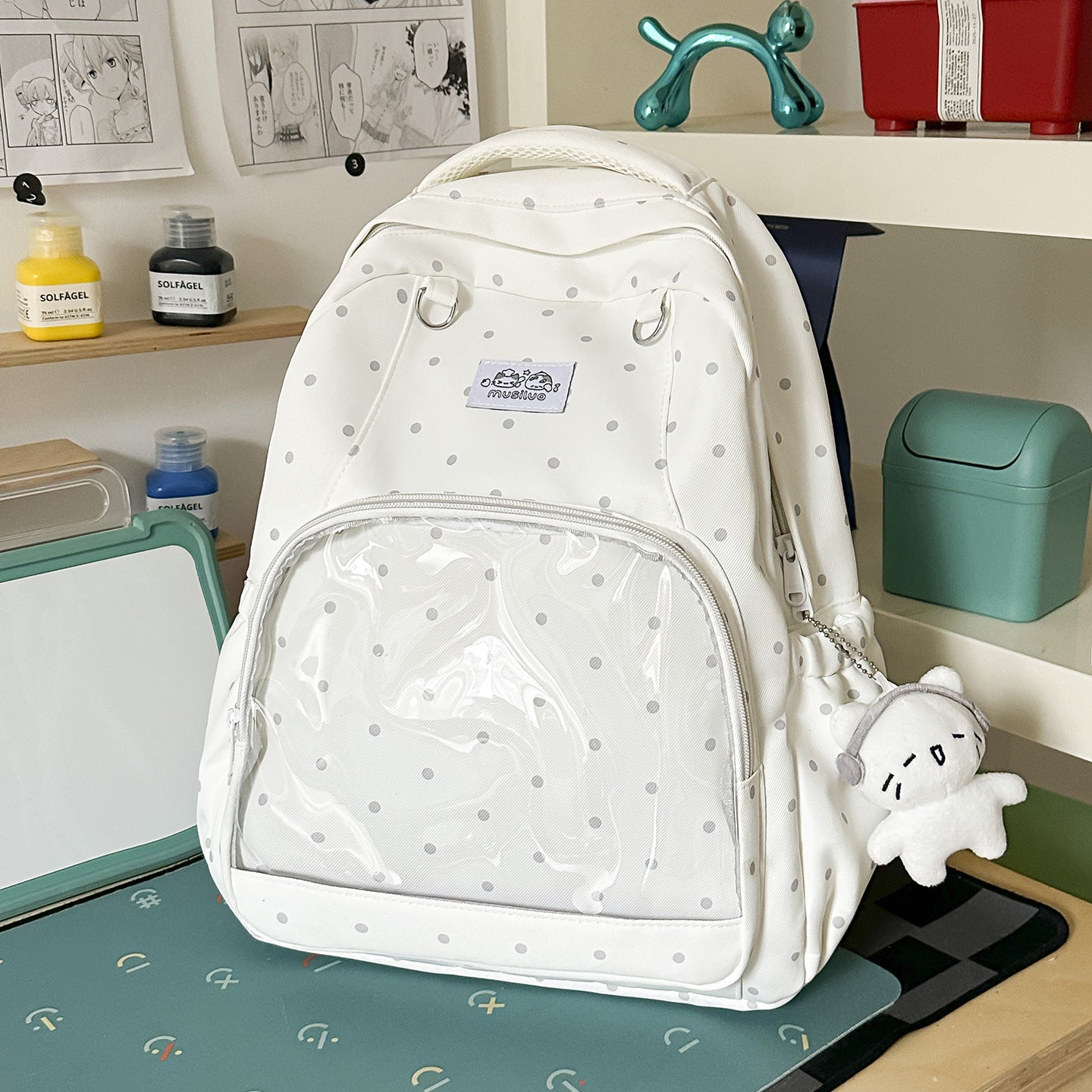Lustiger gepunkteter Schulrucksack