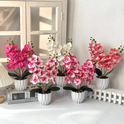 Dekoratives künstliches Orchideenarrangement für die Innendekoration zu Hause