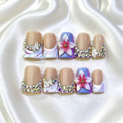 Dekoratives florales Nagelkunstset mit Strassteinen