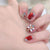 Elegantes mit Edelsteinen verziertes Press-On-Nagelset Brehn