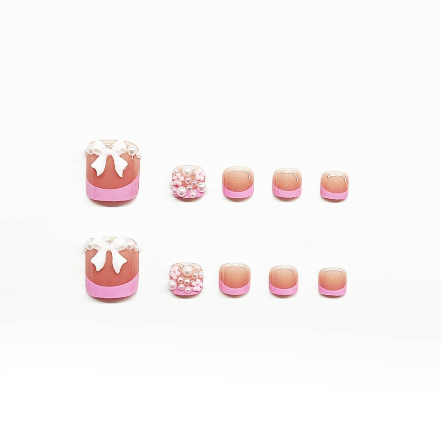 Dekorativer Press-On Nagelkunst Set mit floralen und Schleifenakzenten Brehn