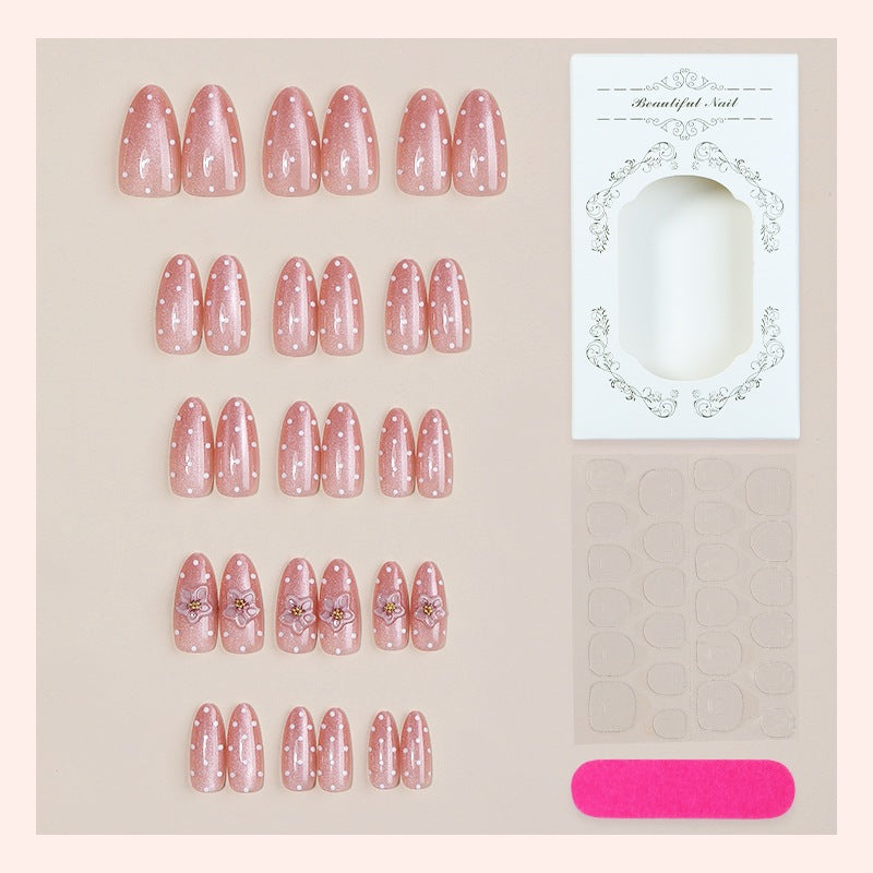 Kunstnagelset mit Glitzer sowie zarten Blüten- und Strassverzierungen Brehn