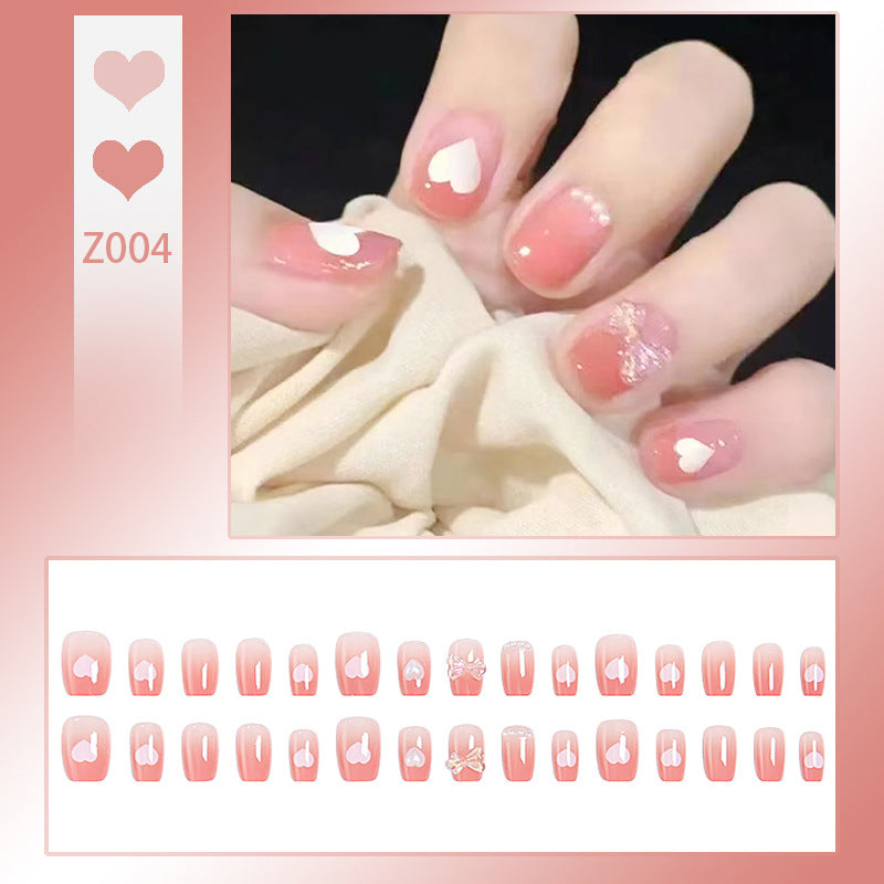 Kunstnagelset mit elegantem French-Tipp und Glitzerakzenten Brehn
