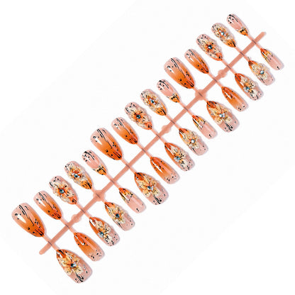 Kunstnagelset mit eleganten floralem Design und raffinierten Glitzerelementen Brehn