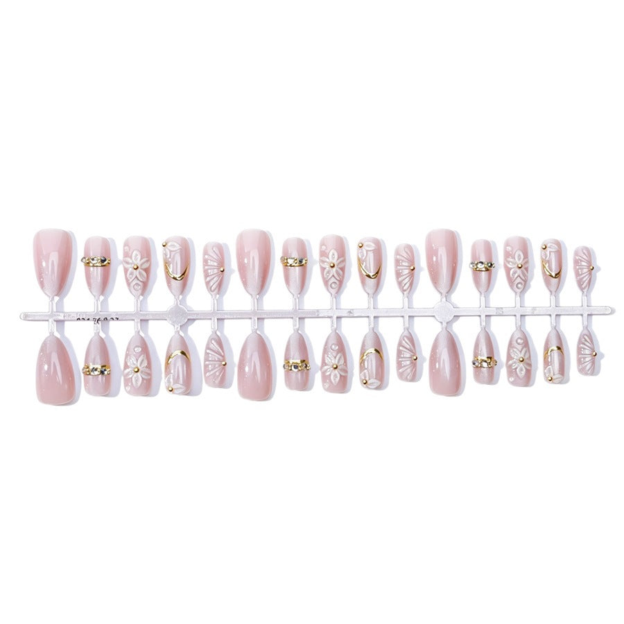 Elegantes Kunstnagelset mit Blumen- und Glitzerelementen Brehn