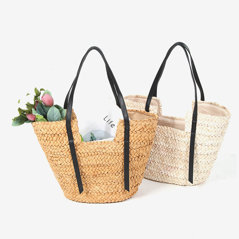 Damen Handtasche aus geflochtenem Naturmaterial mit eleganten Ledergriffen Brehn