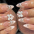 Kunstnagelset mit eleganten Perl- und Schleifenverzierungen Brehn