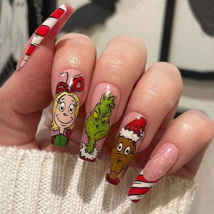Kunstnagelset mit festlichen Motiven und charmantem Grinch Design Brehn