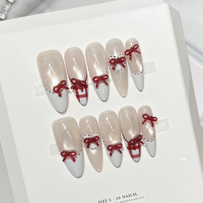 Dekorativer Stiletto Press-On Nagelset mit Schleifenakzenten Brehn