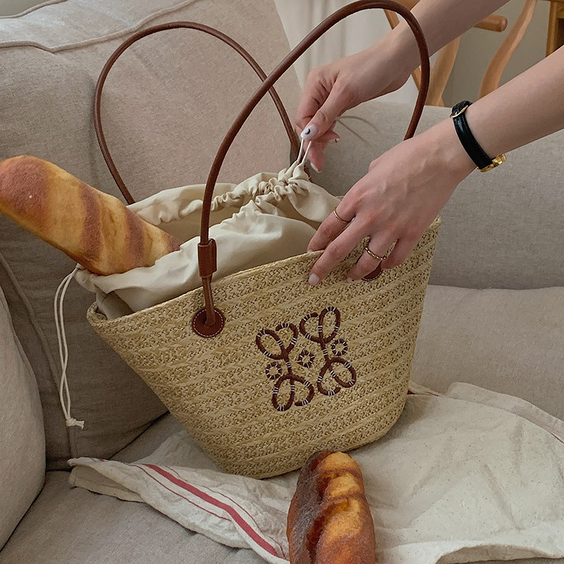 Damen Elegante Handtasche aus geflochtenem Naturmaterial mit luxuriösen Ledergriffen Brehn