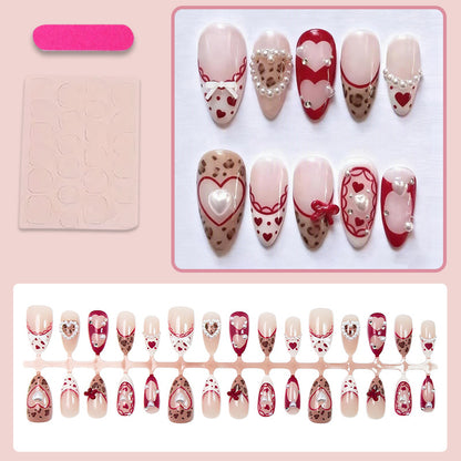 Kunstnagelset mit romantischen Herz- und Schleifenverzierungen Brehn