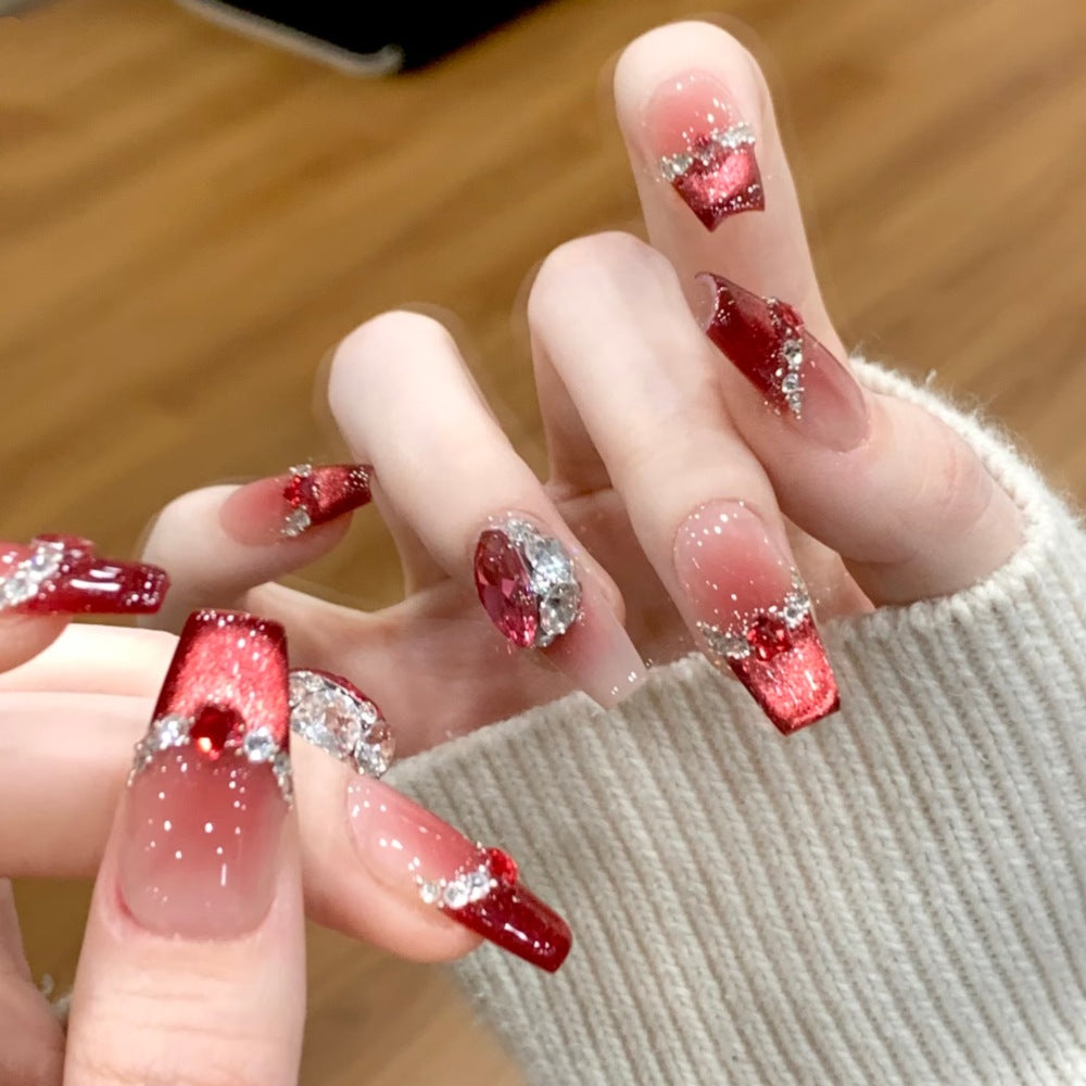 Künstlerisches Langes Stiletto Press-On Nagelset mit Schleife und Edelsteinakzenten Brehn