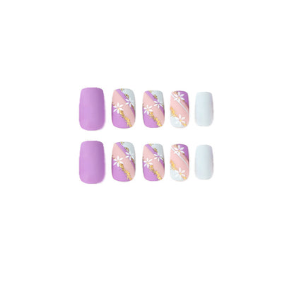 Kunstvolle Nageldesigns mit Blumenmotiv und Glitzerakzenten Brehn
