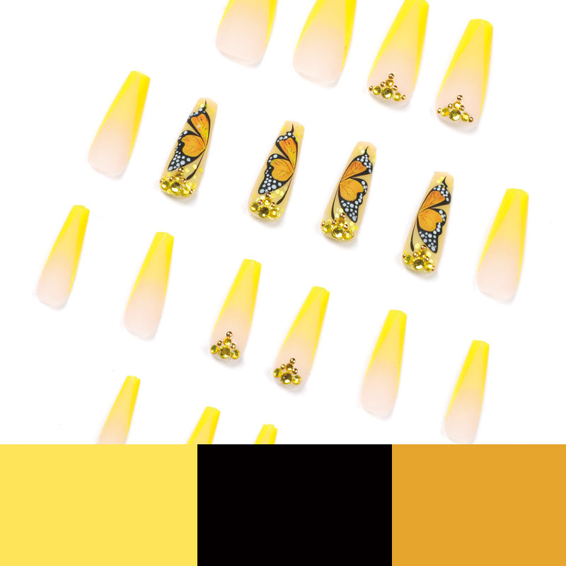Kunstvolle Gel-Nägel mit Schmetterlings-Design und Glitzer Brehn