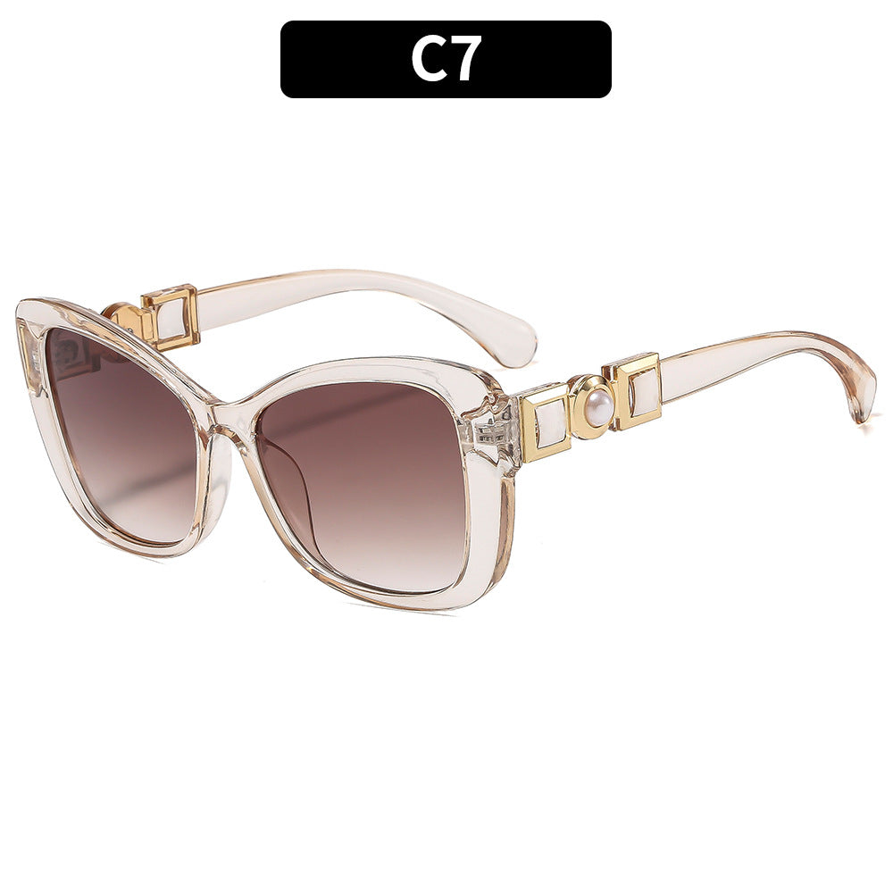 Elegante Katzenaugen-Sonnenbrille mit dekorativem Akzent