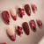 Kunstnagelset mit eleganten Blumendetails und Glitzerakzenten Brehn