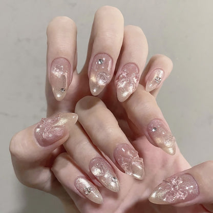 Kunstvolle Stiletto-Nägel mit floralen Design und Glitzer-Akzenten Brehn
