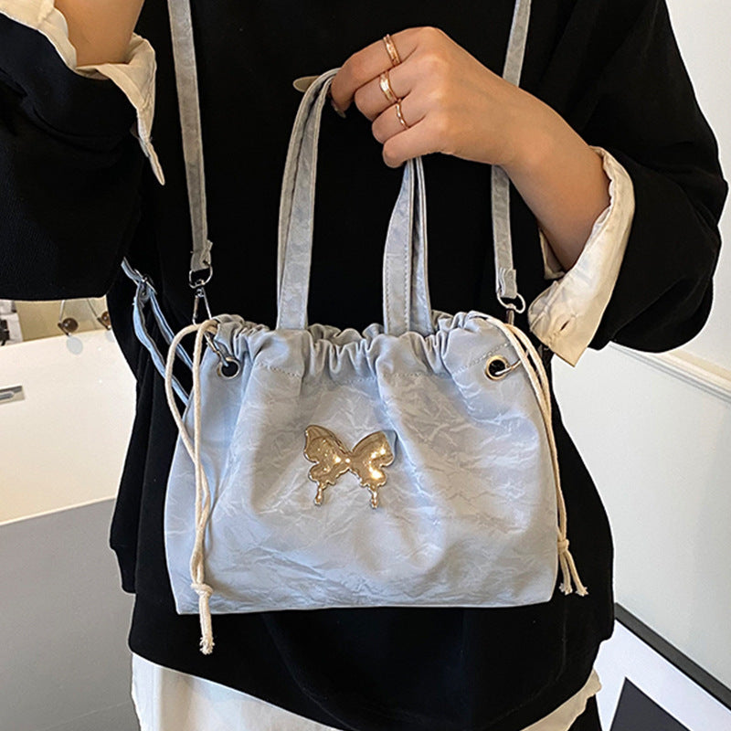 Elegante Mini-Handtasche mit Perlenakzenten und Kordelzug