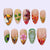 Kunstnagelset mit tropischen Motiven und eleganten Details Brehn