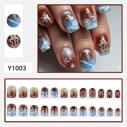 Kunstnägel mit festlichem Schneeflocken- und Lebkuchenmotiv Brehn