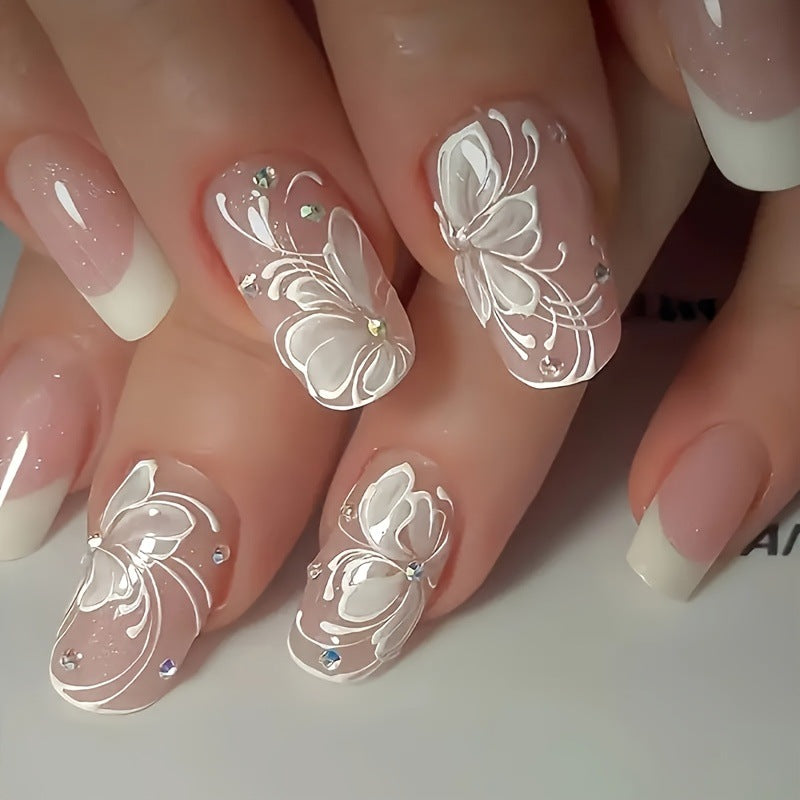 Kunstnagelset mit filigraner Blüten- und Glitzerverzierung Brehn