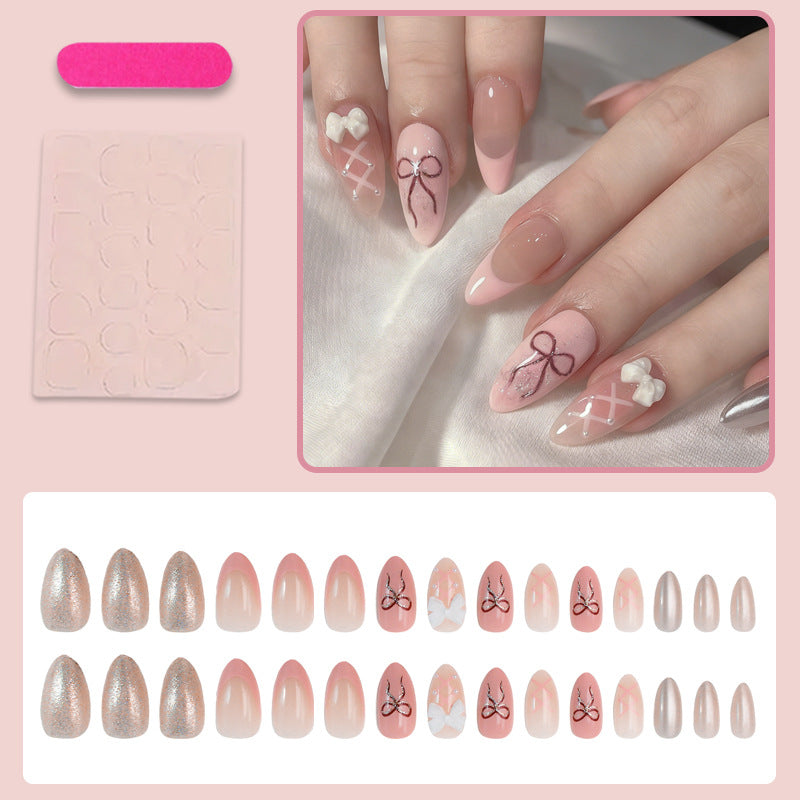Kunstnagelset mit romantischen Schleifen- und Blumenverzierungen Brehn