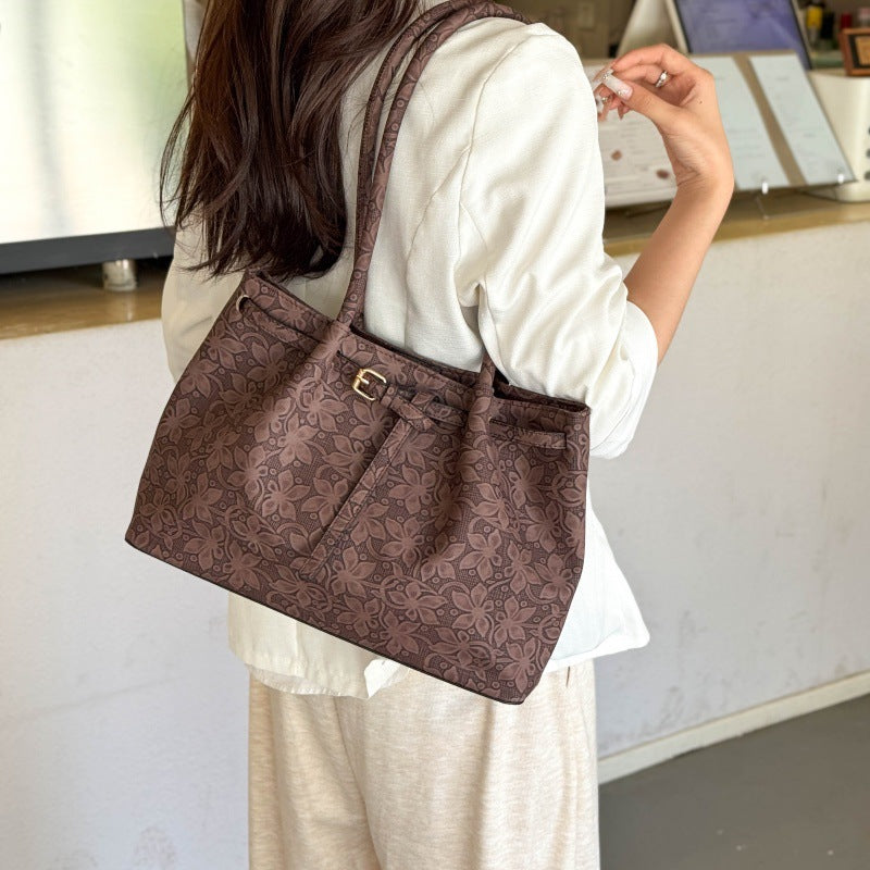 Elegante Handtasche mit floralem Muster