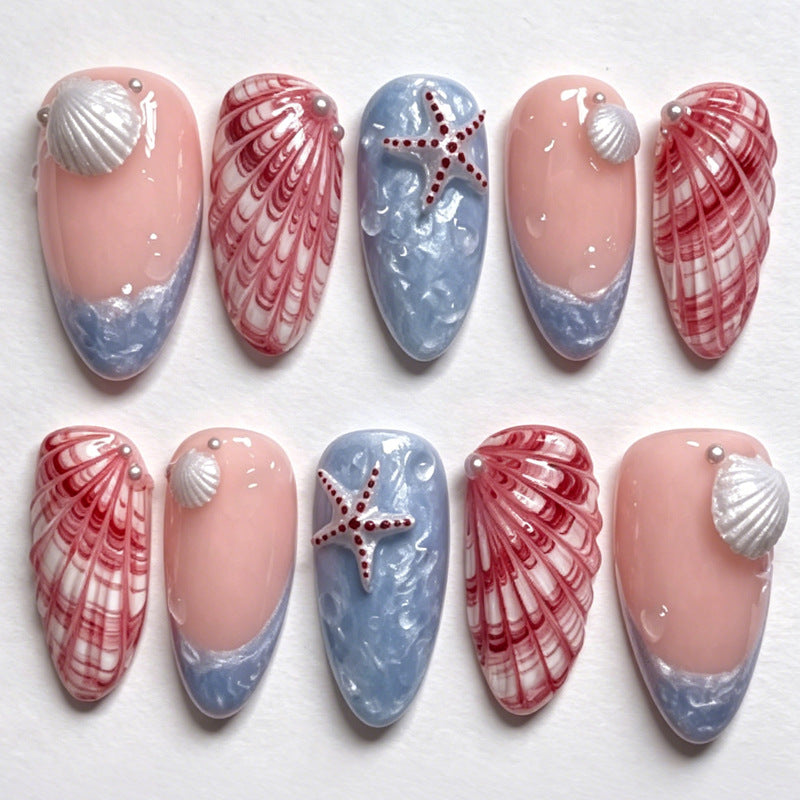 Kunstnagelset mit maritimen Muschel- und Sternenmotiven Brehn