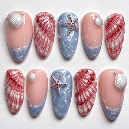 Kunstnagelset mit maritimen Muschel- und Sternenmotiven Brehn