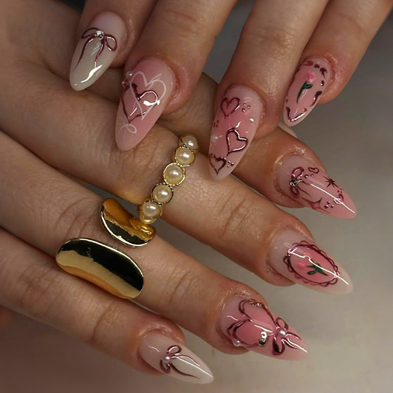 Kunstnagelset mit romantischen Herzen und Schleifen-Design Brehn