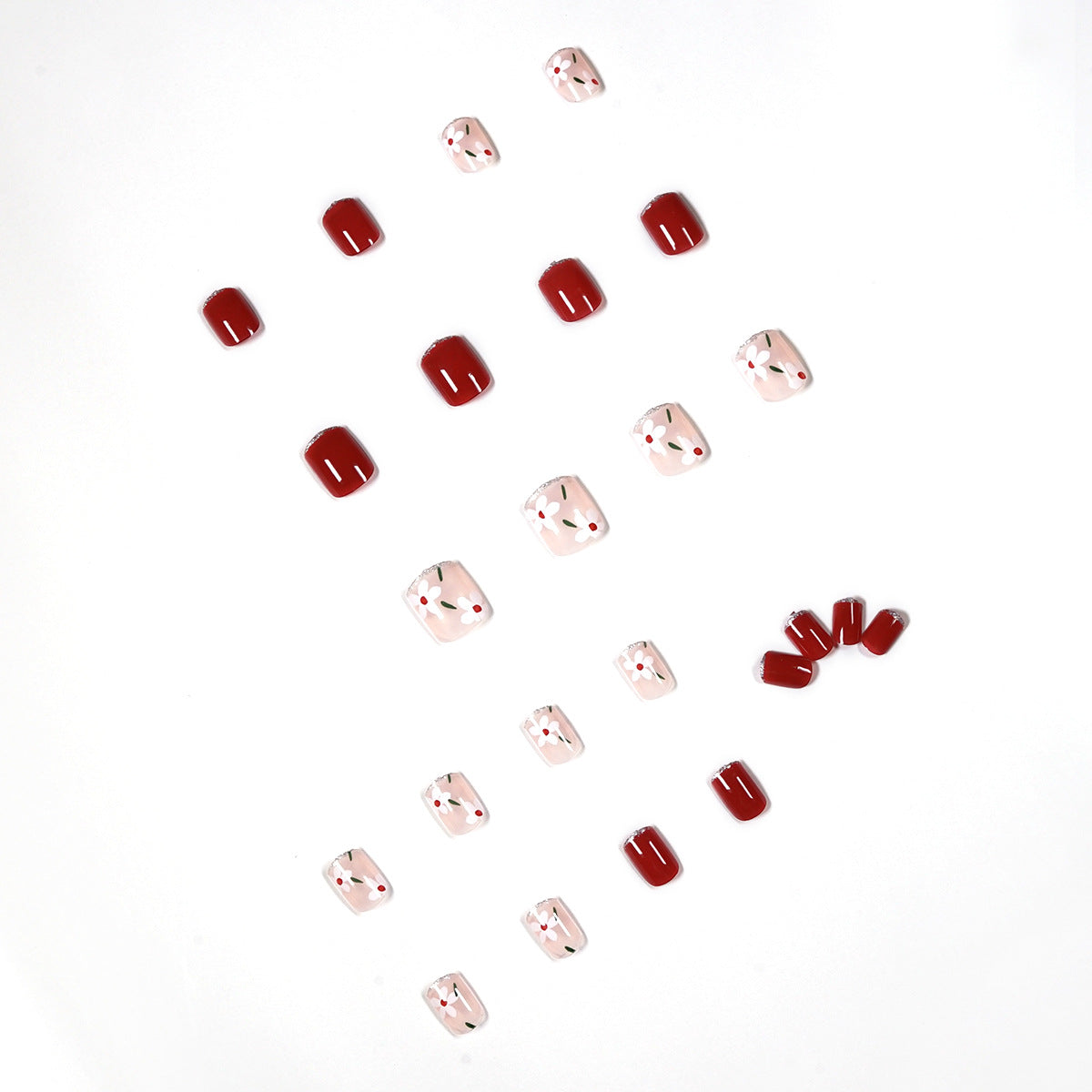 Kunstvolle Nagelkunst mit floralen Motiven und Glitzerakzenten Brehn
