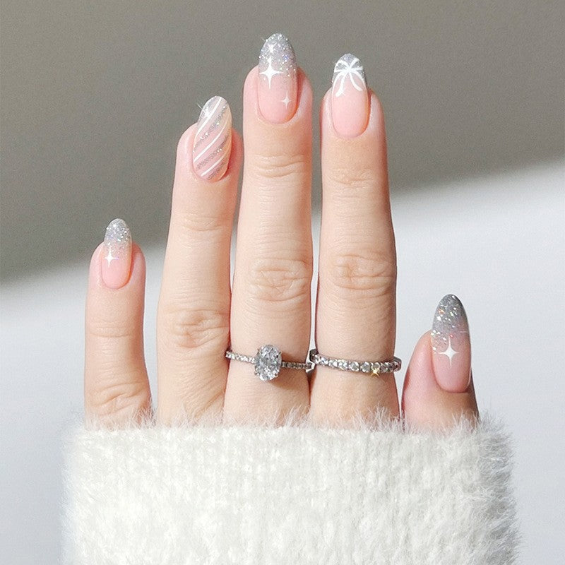 Dekorativer Press-On-Nagelset mit Glitzer und gestreiftem Design Brehn