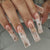 Kunstnagelset mit glamourösen Goldverzierungen Brehn