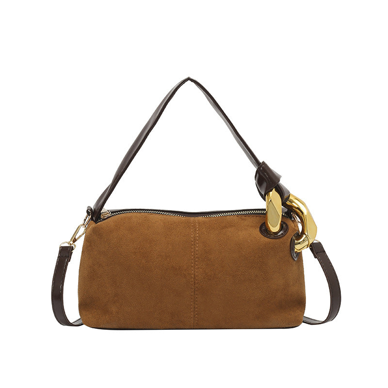 Elegante Wildleder-Handtasche mit goldenen Akzenten
